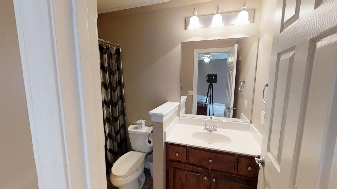 919 Sam Johnson Road Columbia, TN 38401 - Photo 22 of 29 a bathroom with a sink a toilet and shower