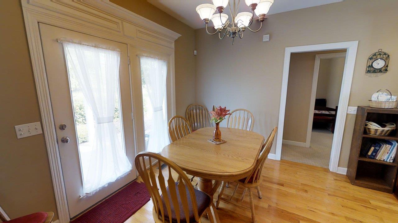 919 Sam Johnson Road Columbia, TN 38401 - Photo 10 of 29 a view of a dining room with furniture and wooden floor