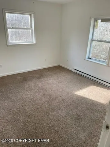a view of a balcony with wooden fence