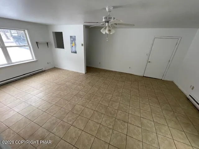 a view of a room with an empty space and a window