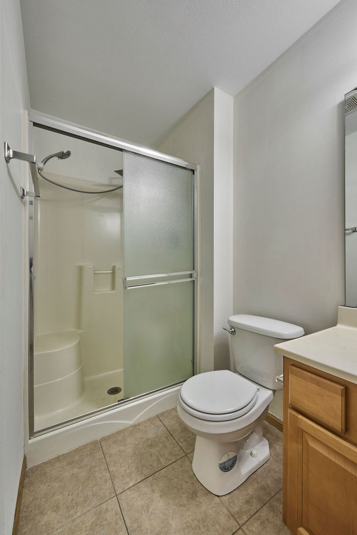 962 Arvle Circle, Unit 962 Sycamore, IL 60178 - Photo 14 of 18 a bathroom with a toilet and a shower