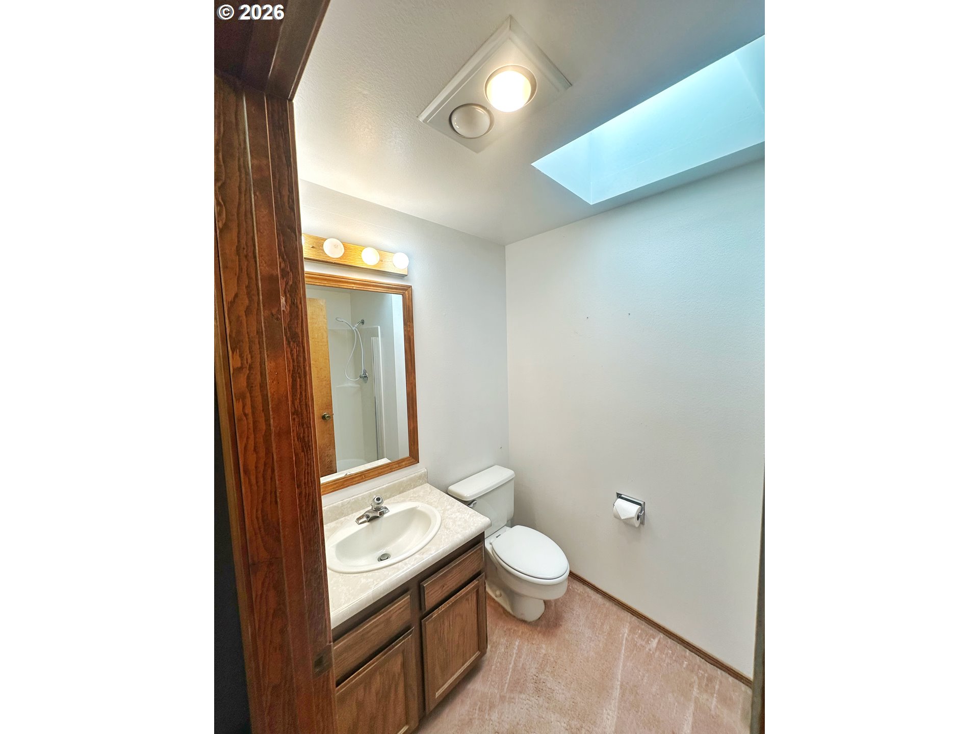 10710 South McAlister Road Island City, OR 97850 - Photo 21 of 22 a bathroom with a toilet sink and mirror
