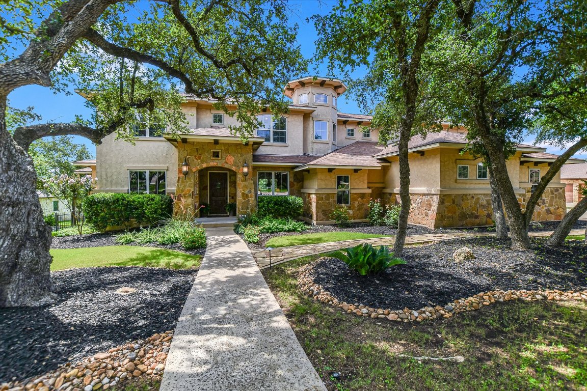 a front view of a house with garden