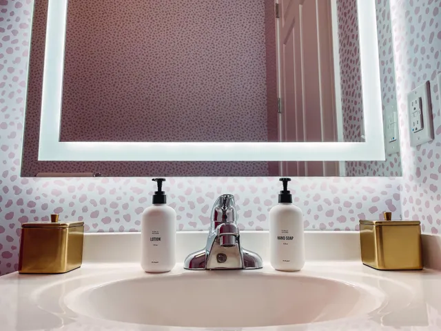 a bathroom with a sink a toilet and shower curtain