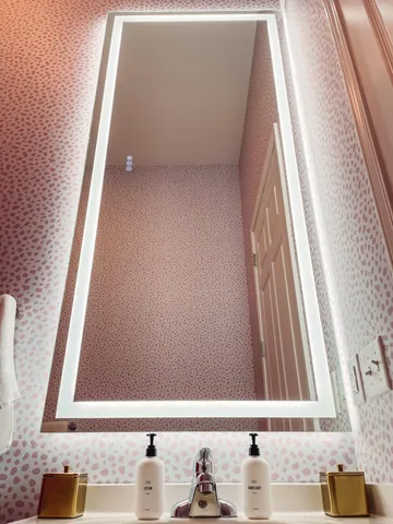 a white vase with flowers