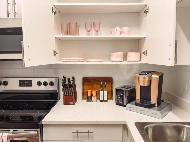 a kitchen with a stove and cabinets