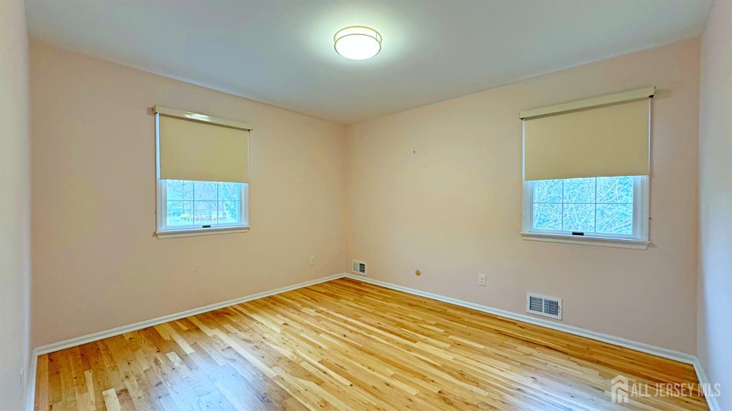 26 Lucille Court Edison, NJ 08820 - Photo 13 of 22 a view of a room with wooden floor and a window