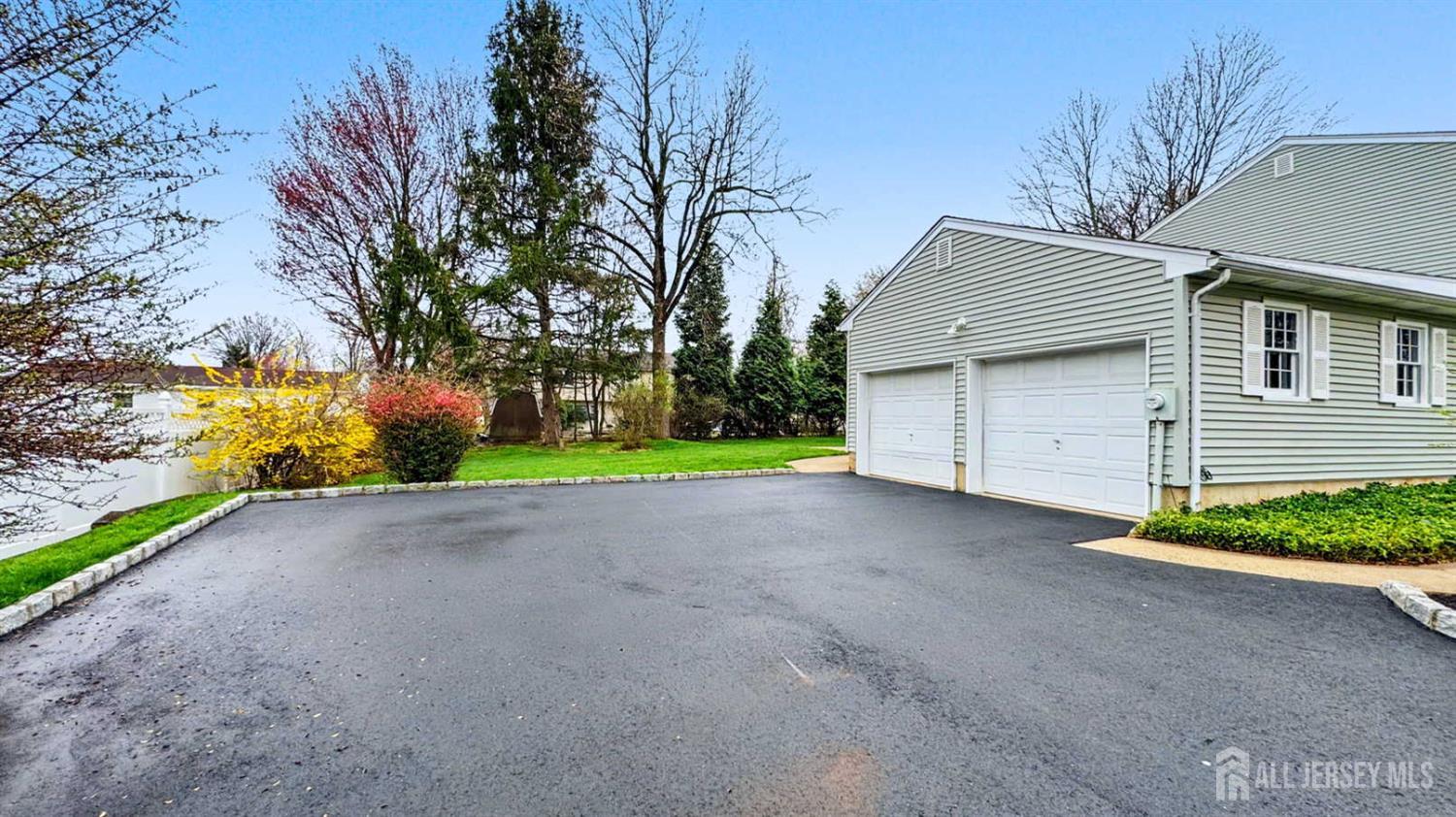 26 Lucille Court Edison, NJ 08820 - Photo 18 of 22 a view of a house with a yard and garage