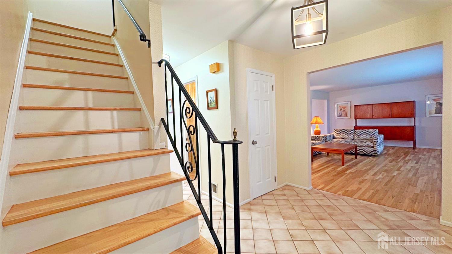 26 Lucille Court Edison, NJ 08820 - Photo 2 of 22 a view of a livingroom with furniture and staircase