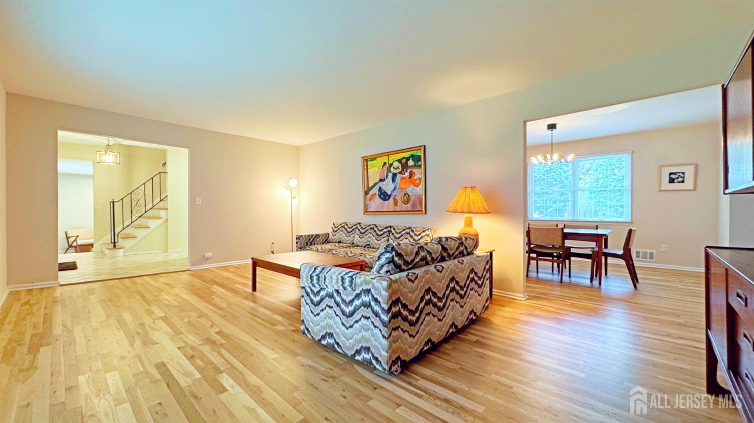 26 Lucille Court Edison, NJ 08820 - Photo 3 of 22 a living room with furniture and a wooden floor