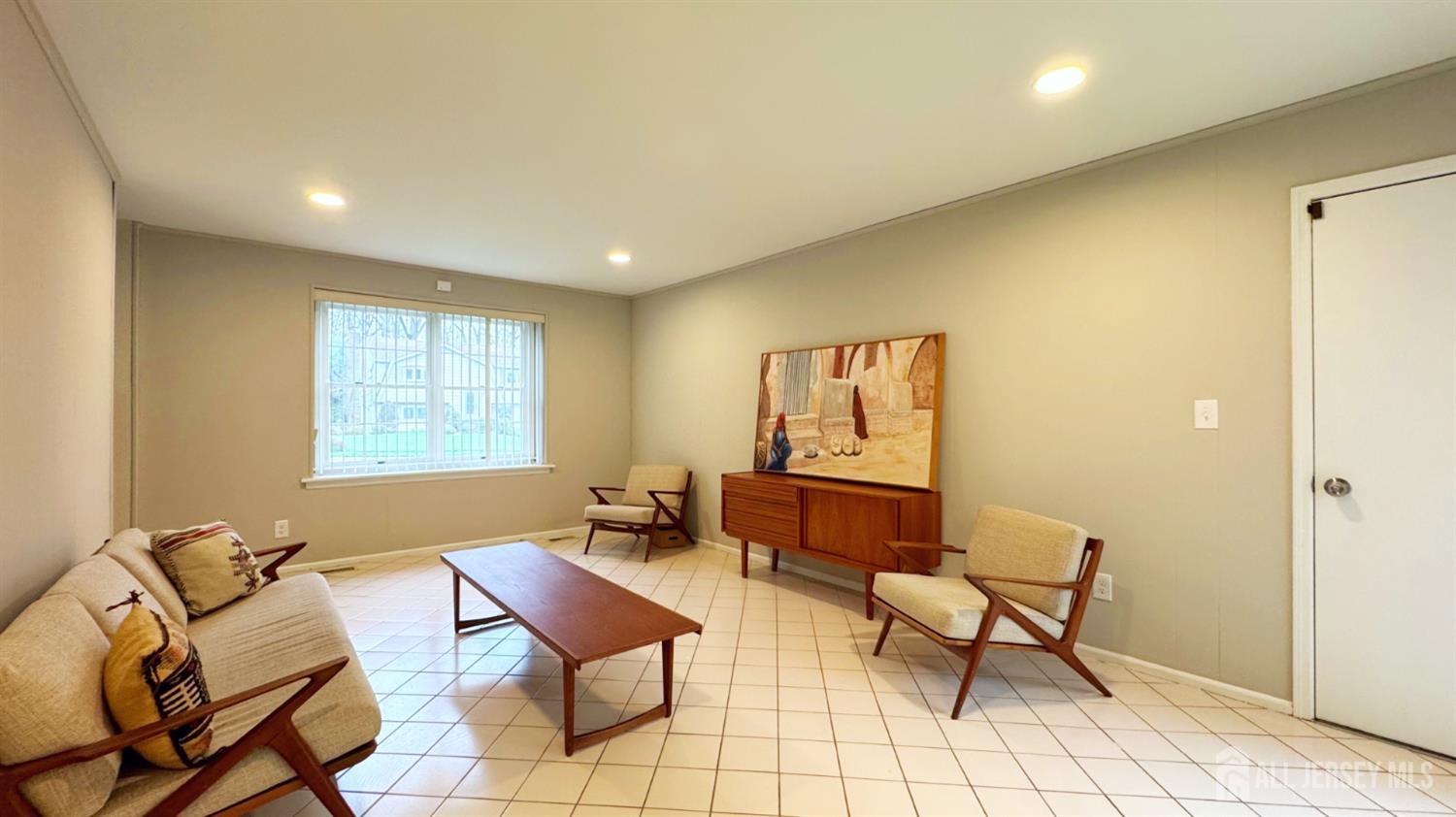 26 Lucille Court Edison, NJ 08820 - Photo 4 of 22 a living room with furniture and a window