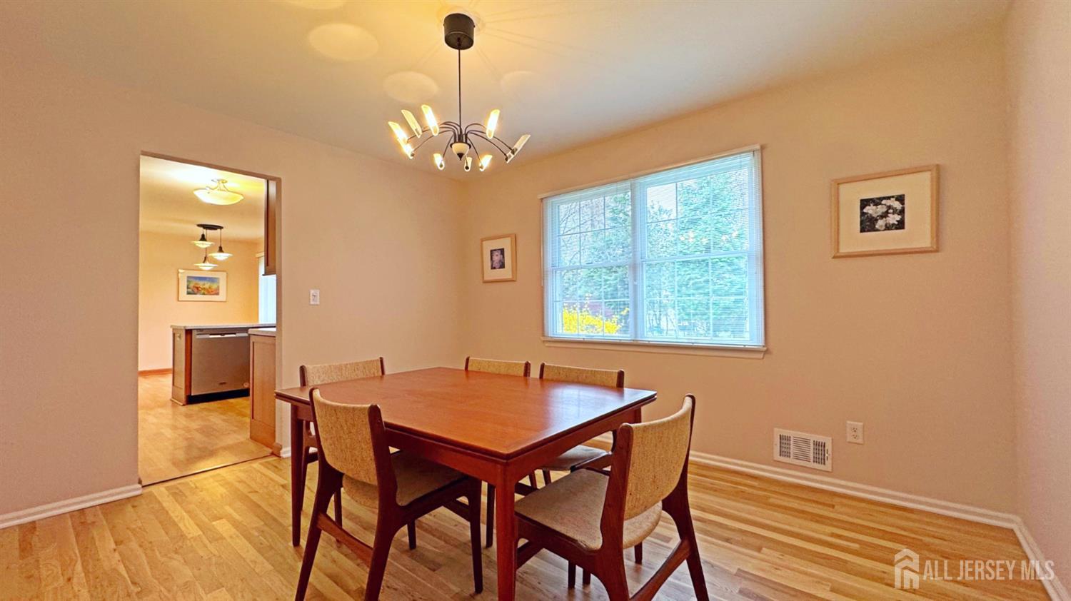 26 Lucille Court Edison, NJ 08820 - Photo 5 of 22 a view of a dining room with furniture and chandelier