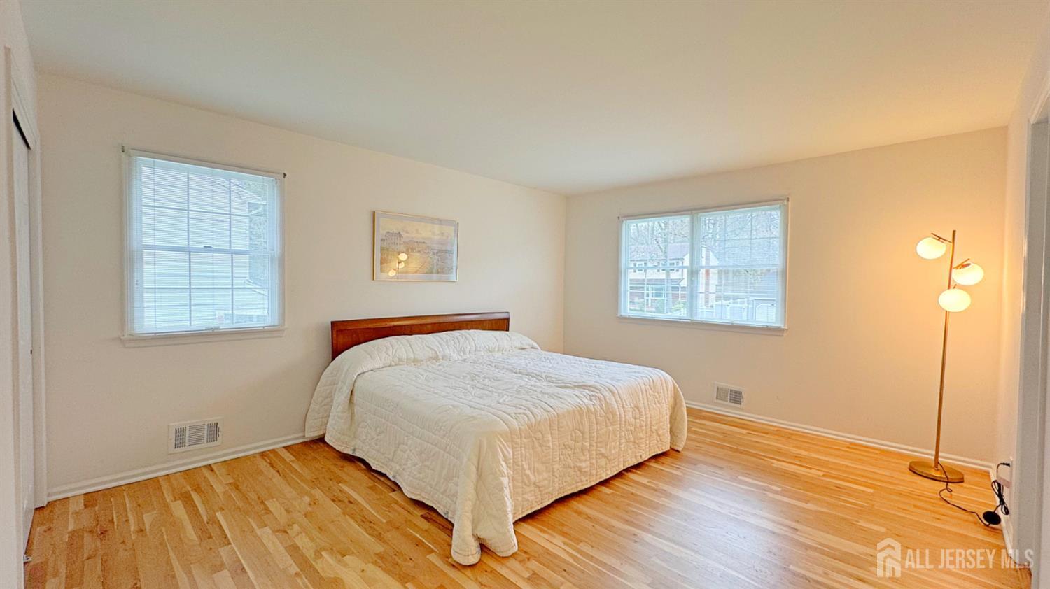 26 Lucille Court Edison, NJ 08820 - Photo 9 of 22 a bedroom with a bed and wooden floor