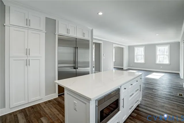 a kitchen with a stove and a refrigerator