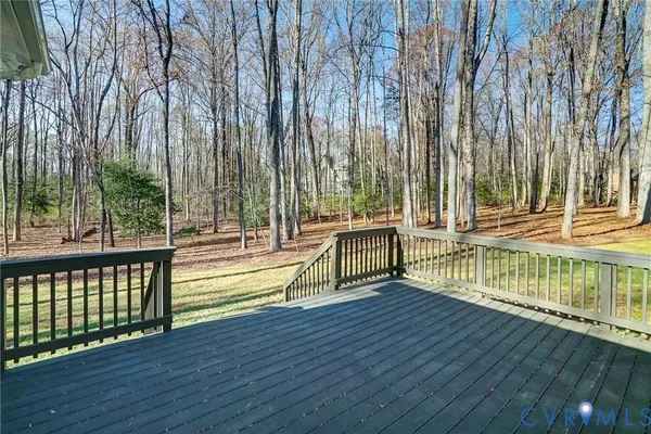 a view of a swimming pool with a bench
