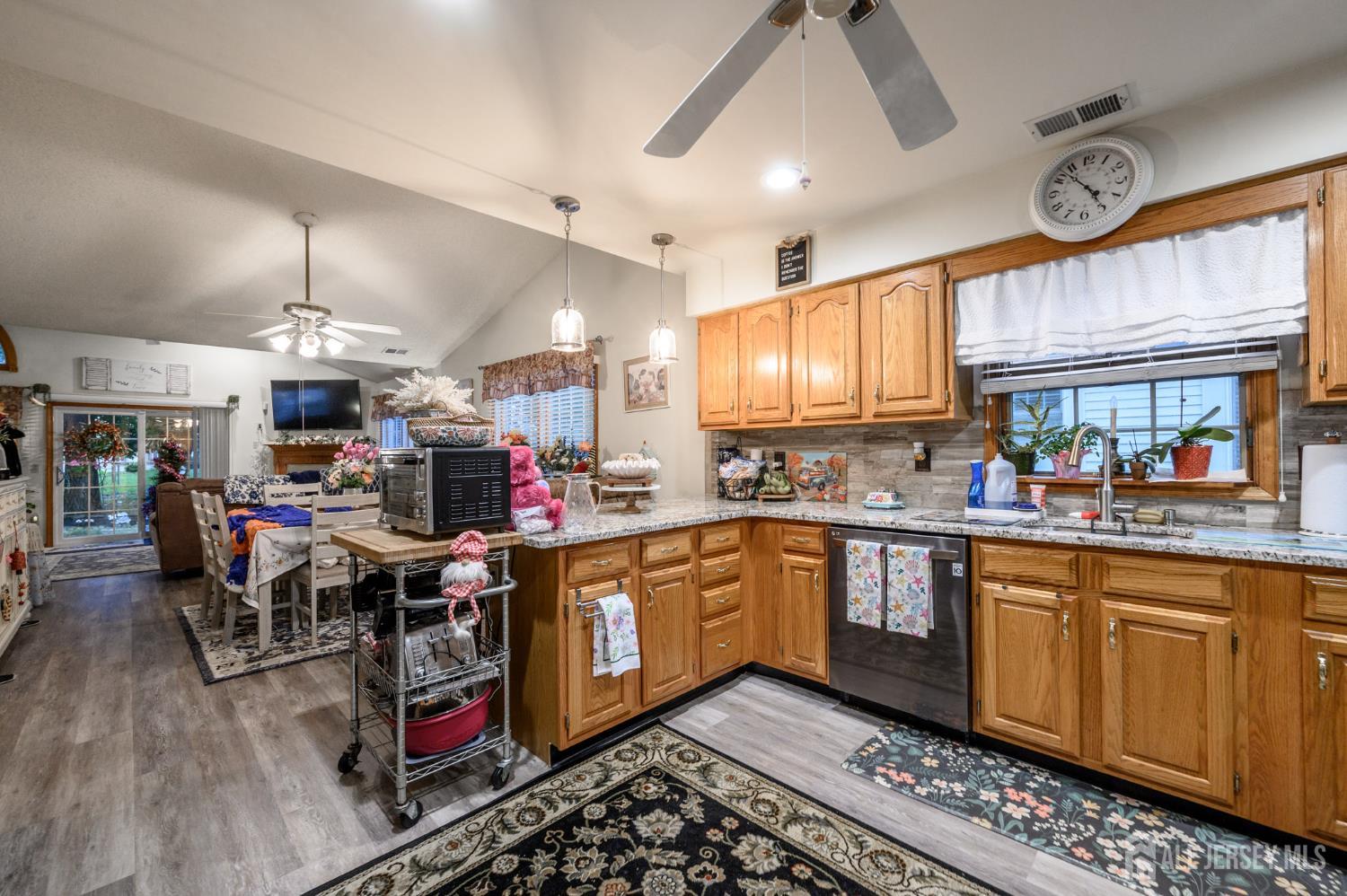 1617 Sweetbay Drive Toms River, NJ 08755 - Photo 13 of 32 a kitchen with stainless steel appliances granite countertop a stove cabinets and wooden floor