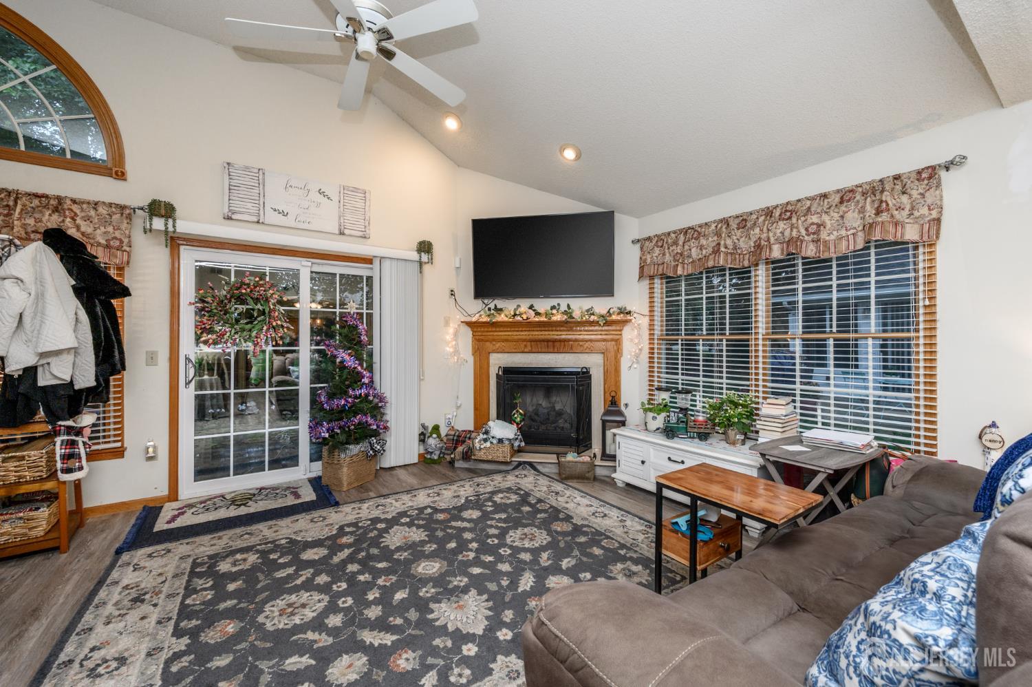 1617 Sweetbay Drive Toms River, NJ 08755 - Photo 17 of 32 a living room with furniture a fireplace and a flat screen tv