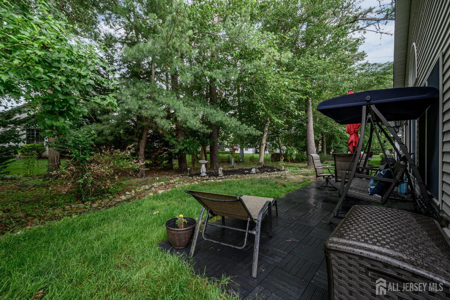 1617 Sweetbay Drive Toms River, NJ 08755 - Photo 29 of 32 a view of a backyard with sitting area furniture and garden