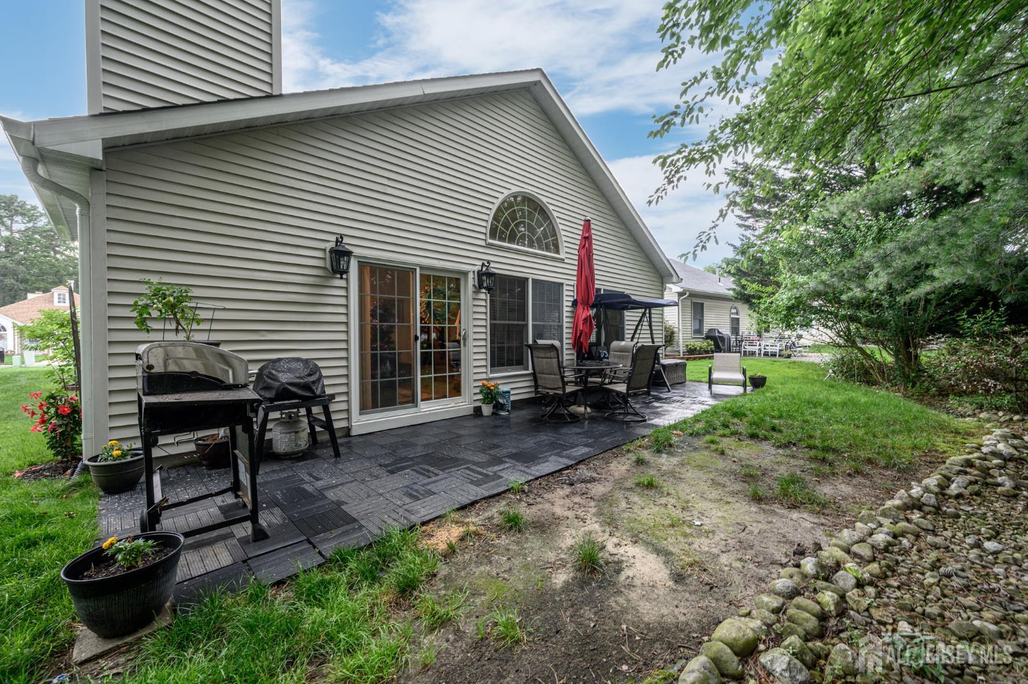 1617 Sweetbay Drive Toms River, NJ 08755 - Photo 30 of 32 a view of a house with backyard and sitting area