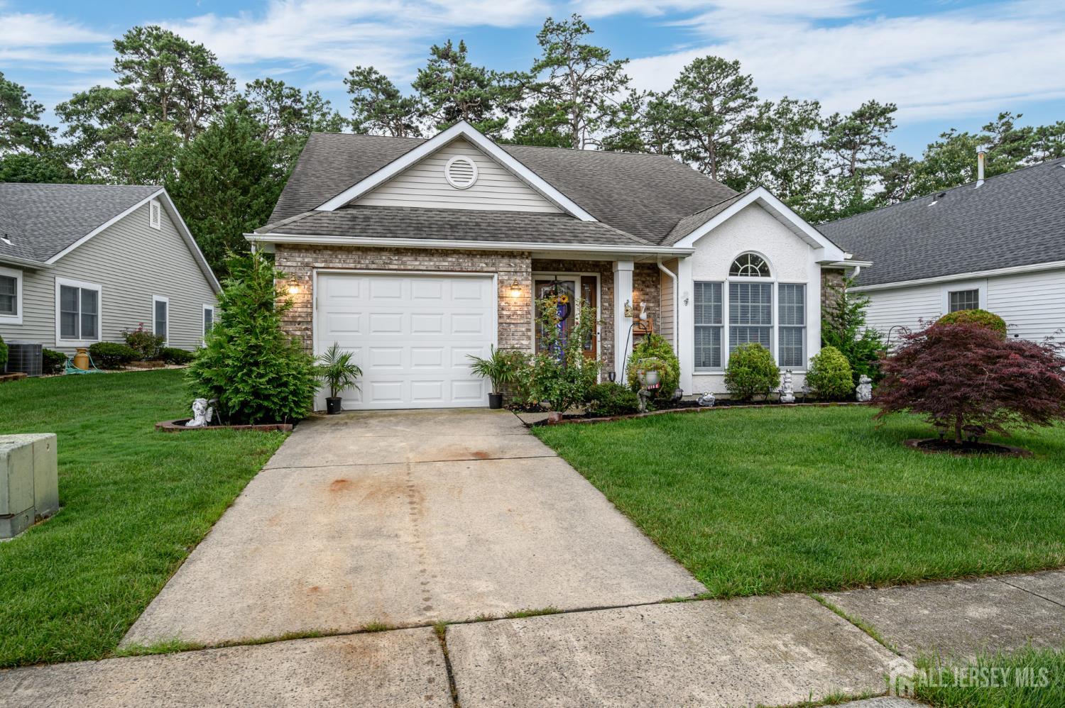 1617 Sweetbay Drive Toms River, NJ 08755 - Photo 32 of 32 a front view of a house with a yard and trees