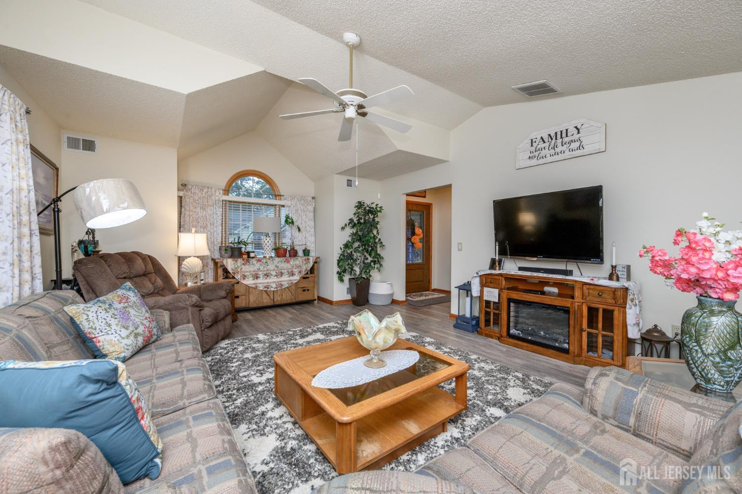 1617 Sweetbay Drive Toms River, NJ 08755 - Photo 5 of 32 a living room with furniture and a flat screen tv