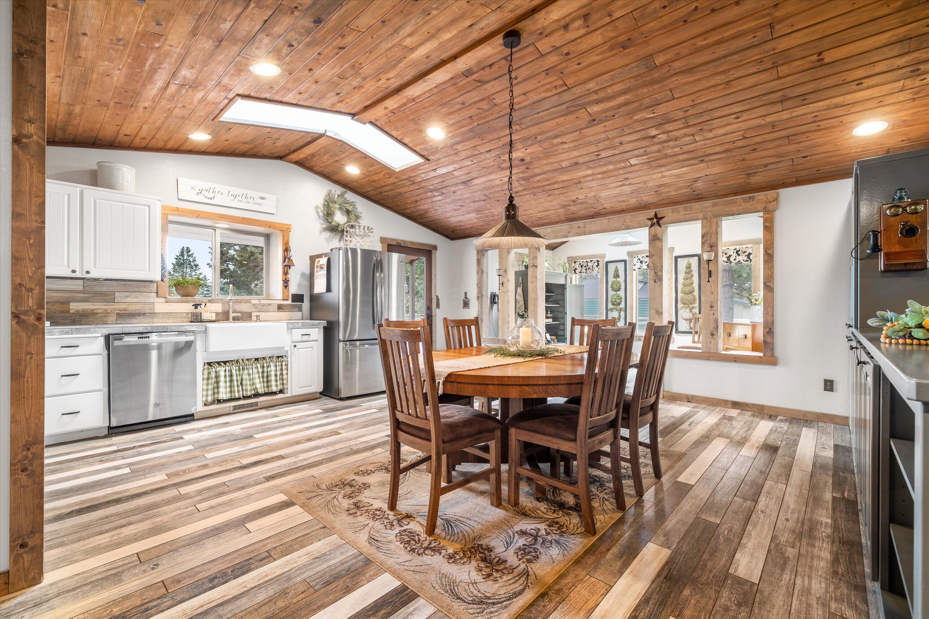 15868 Lundy Road Sisters, OR 97759 - Photo 12 of 53 a view of a dining room with furniture window and wooden floor