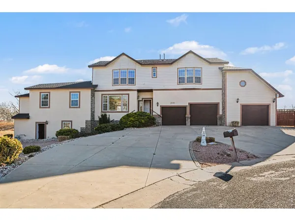 a front view of a house with yard