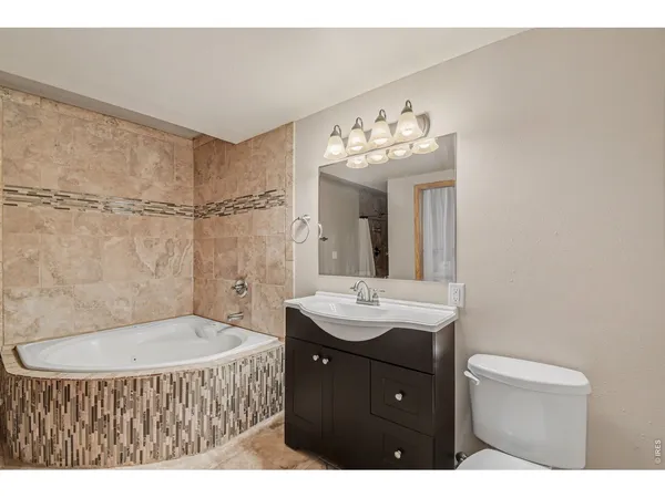 a bathroom with a shower and a sink