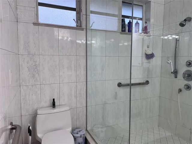 a bathroom with a toilet and shower