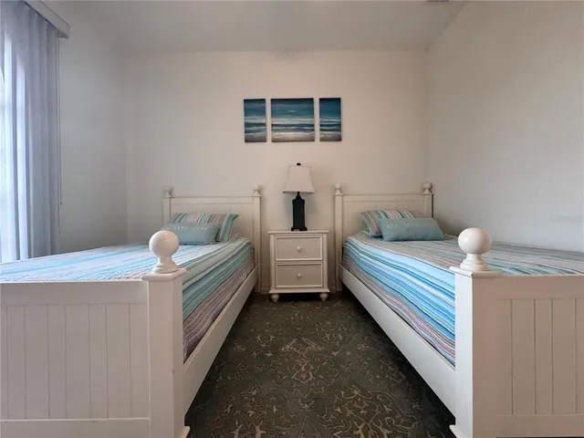 a bathroom with a tub and window