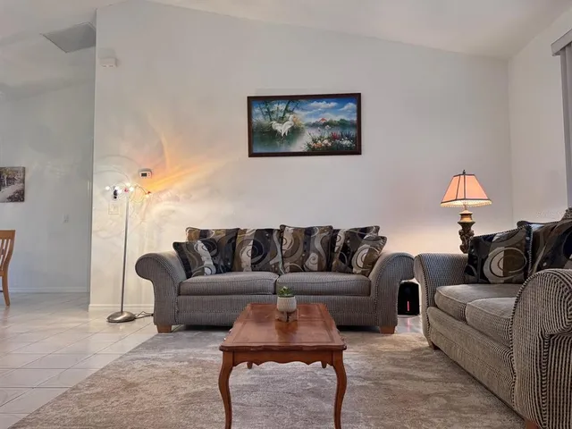 a living room with furniture and a couch