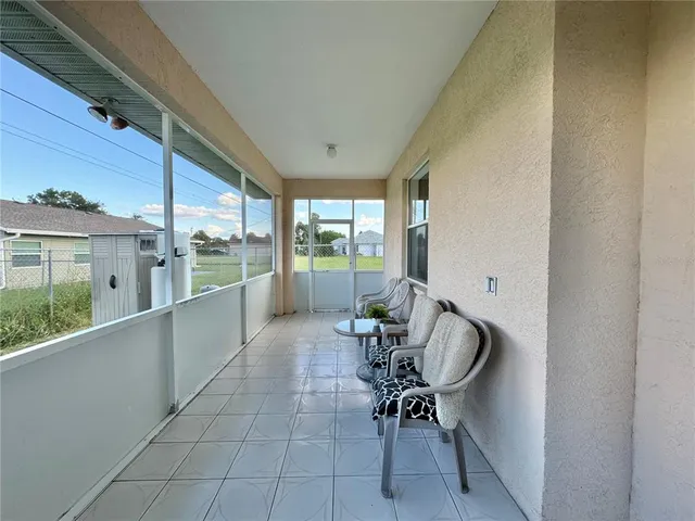 a room with furniture and a large window