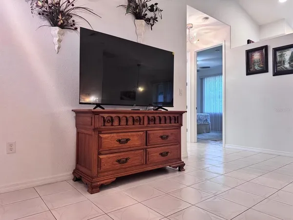 a room with furniture and flat screen tv