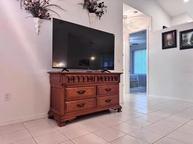 a room with furniture and flat screen tv