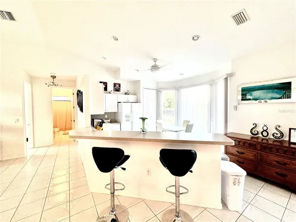 a kitchen with a dining table and chairs