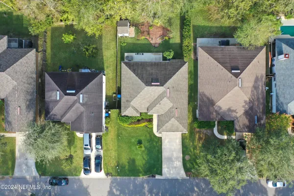 an aerial view of house with yard
