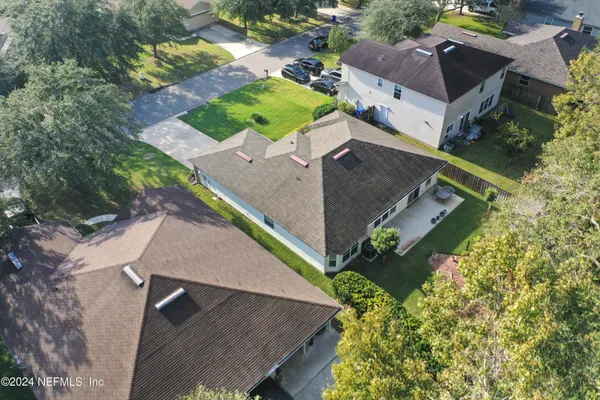 an aerial view of a house with outdoor space