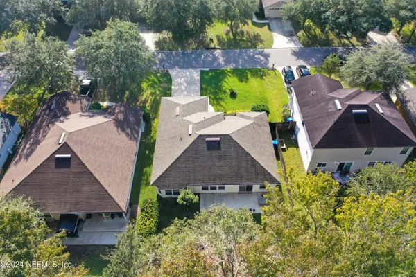 an aerial view of a house with a garden