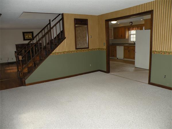 56 Fitzpatrick Road Grafton, MA 01519 - Photo 11 of 24 a view of an empty room with stairs and a window