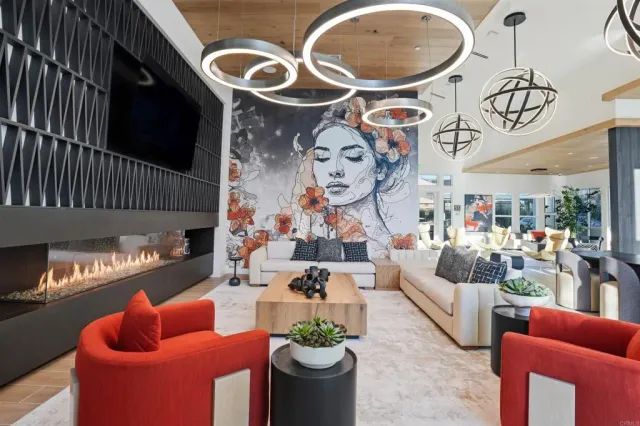 a living room with furniture a rug and white walls