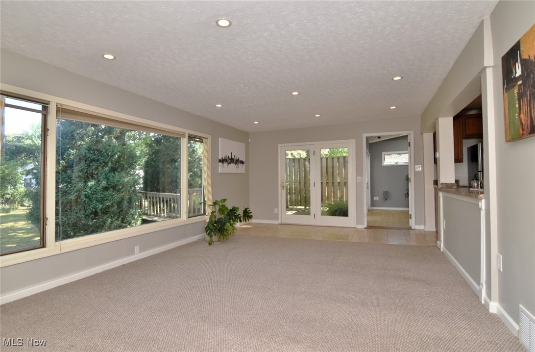 3679 Fenley Road Cleveland Heights, OH 44121 - Photo 20 of 45 Empty room with light colored carpet, recessed lighting, and a textured ceiling