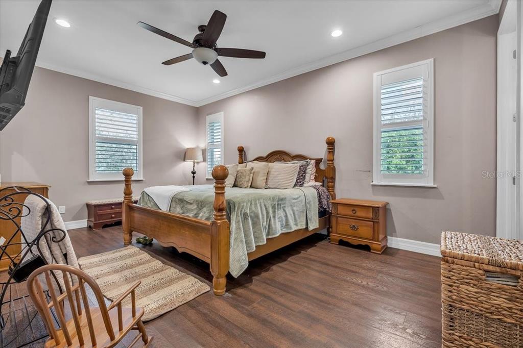 8429 Southwest Riverview Circle Arcadia, FL 34269 - Photo 17 of 45 a bedroom with a bed and a chandelier