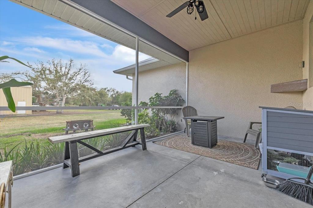 8429 Southwest Riverview Circle Arcadia, FL 34269 - Photo 27 of 45 a view of a terrace with wooden floor and outdoor seating