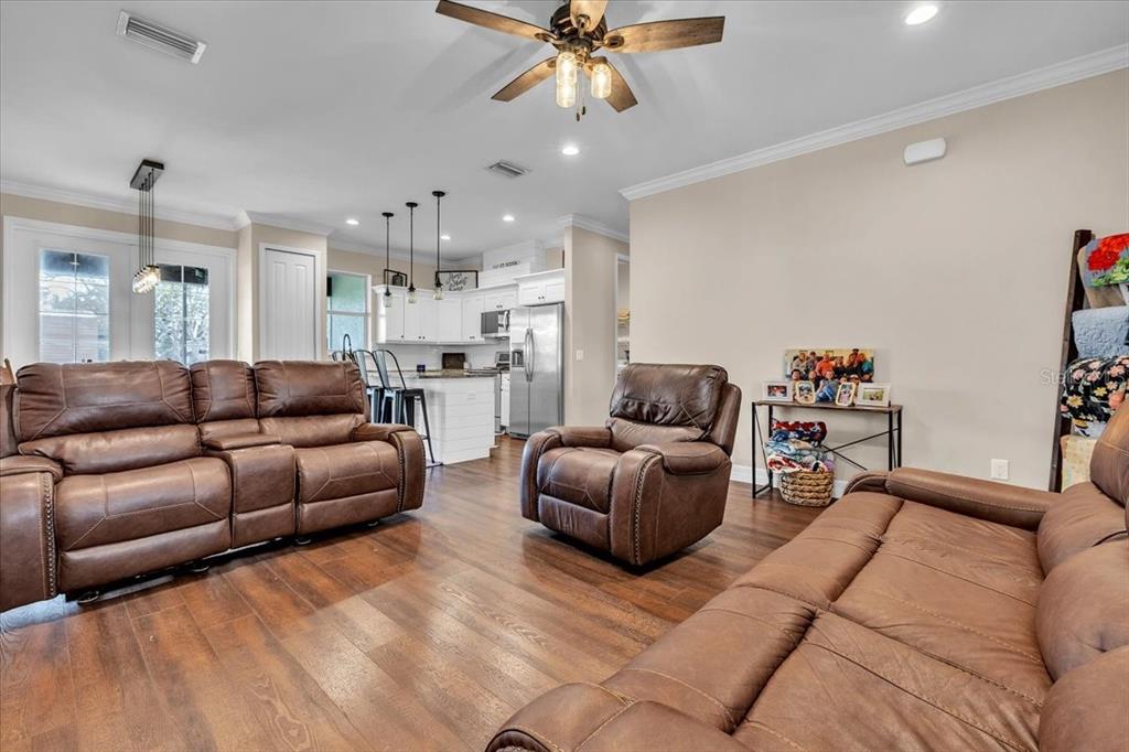 8429 Southwest Riverview Circle Arcadia, FL 34269 - Photo 3 of 45 a living room with furniture and a chandelier