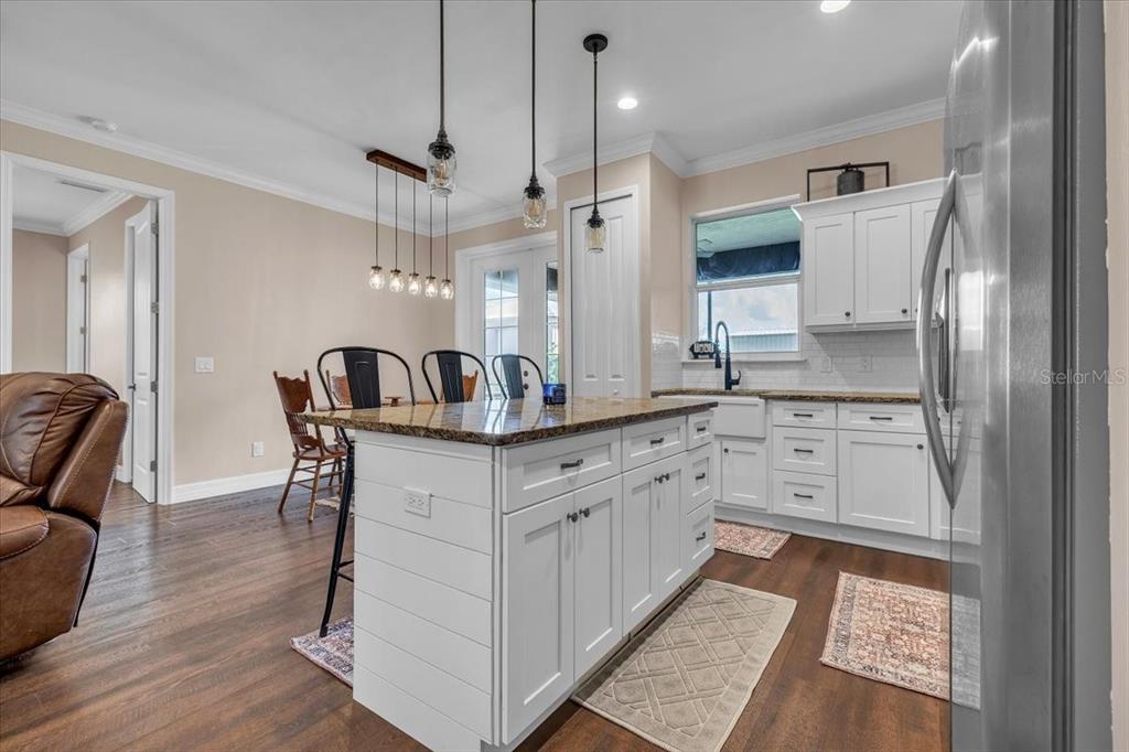 8429 Southwest Riverview Circle Arcadia, FL 34269 - Photo 9 of 45 a kitchen with granite countertop a sink a counter space and stainless steel appliances
