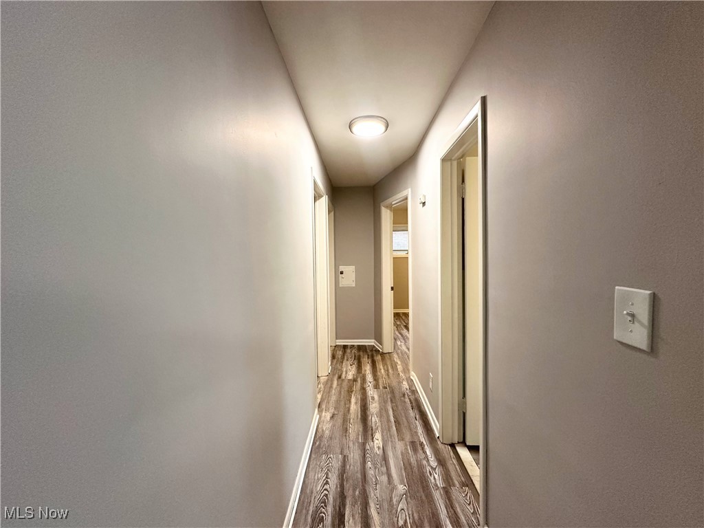 4500 Green Road Cleveland, OH 44128 - Photo 7 of 13 Hallway featuring wood finished floors and baseboards