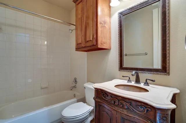 a bathroom with a sink a light fixture and a mirror