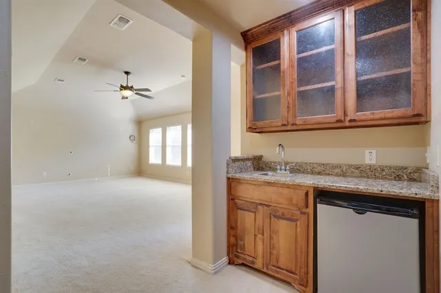 a view of a house with backyard and porch