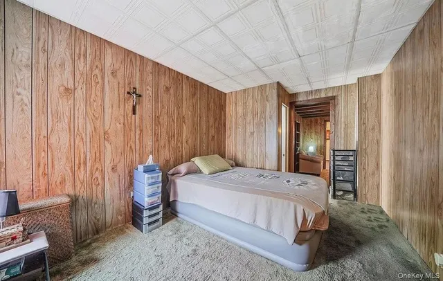 a spacious bedroom with a bed and a table