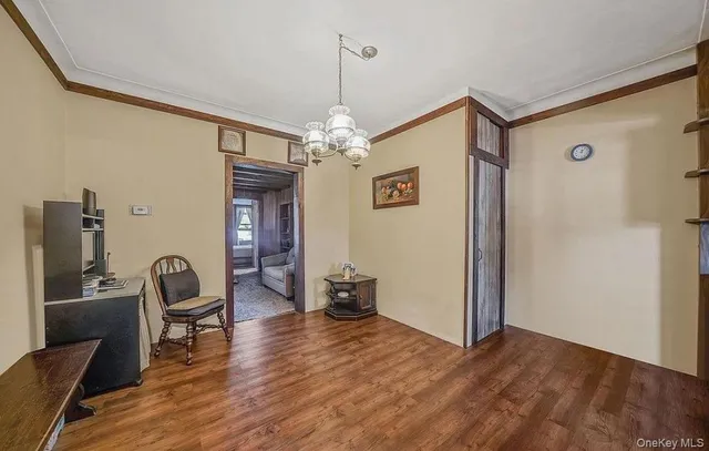 a view of a livingroom with furniture and wooden floor